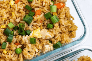 Chicken fried rice cooked in a casserole dish. 