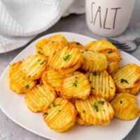 Plate of accordion potatoes cooked.