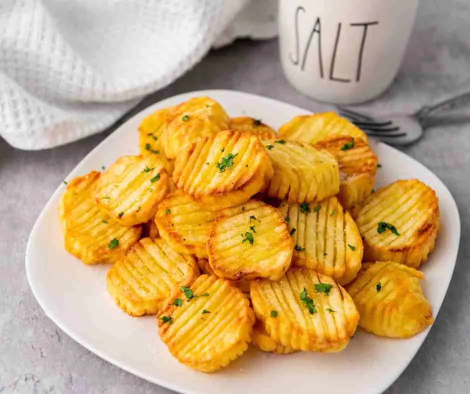 Plate of accordion potatoes cooked.