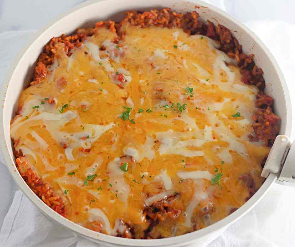 taco rice skillet in white frying pan. 