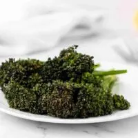 cooked air fryer broccolini on a plate.