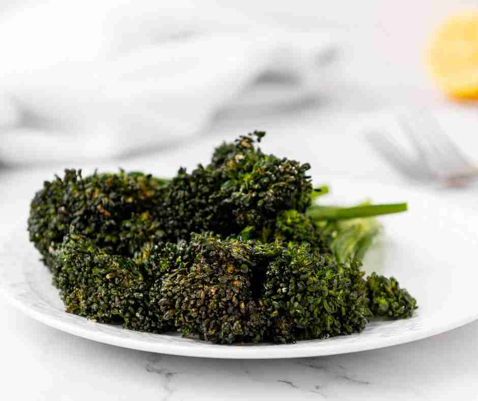 cooked air fryer broccolini on a plate.