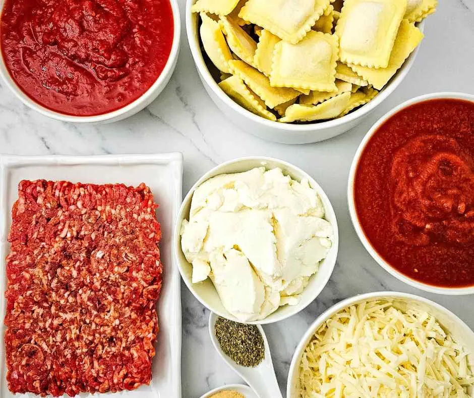 crockpot lasagna ingredients laid out on a table.